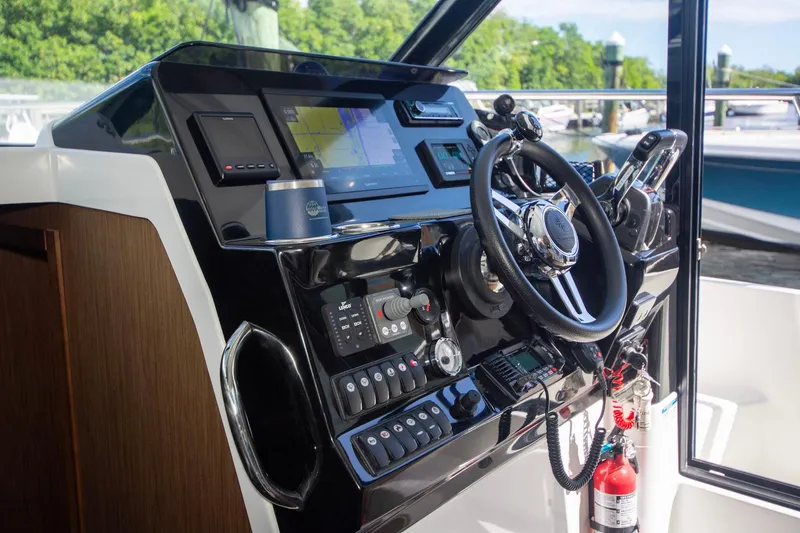 Sea Scape Yacht Photos Pics 2021 Jeanneau NC 1095 helm with modern navigation and control systems.