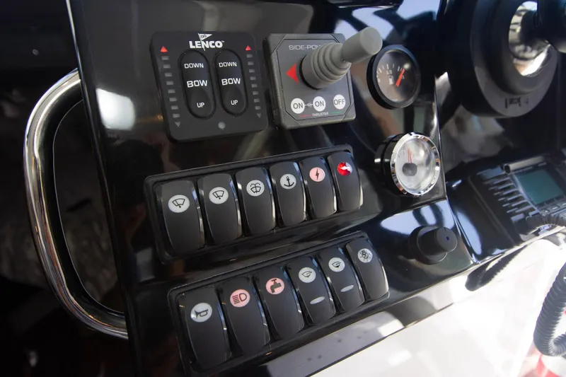 Sea Scape Yacht Photos Pics Control panel of 2021 Jeanneau NC 1095 boat with various switches and gauges.