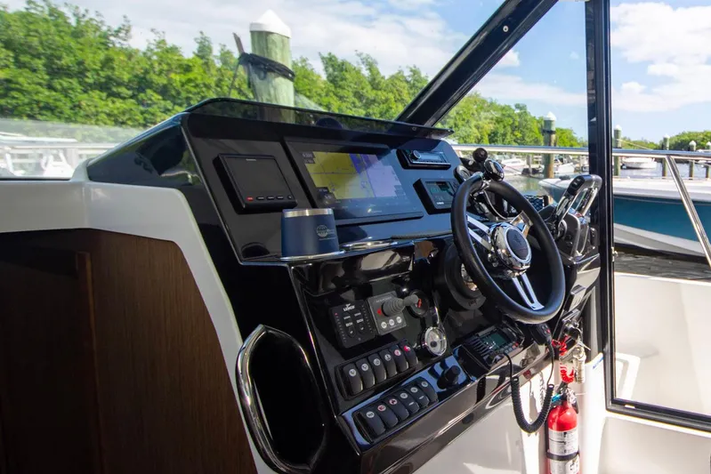 Sea Scape Yacht Photos Pics 2021 Jeanneau NC 1095 helm with modern controls and navigation system.