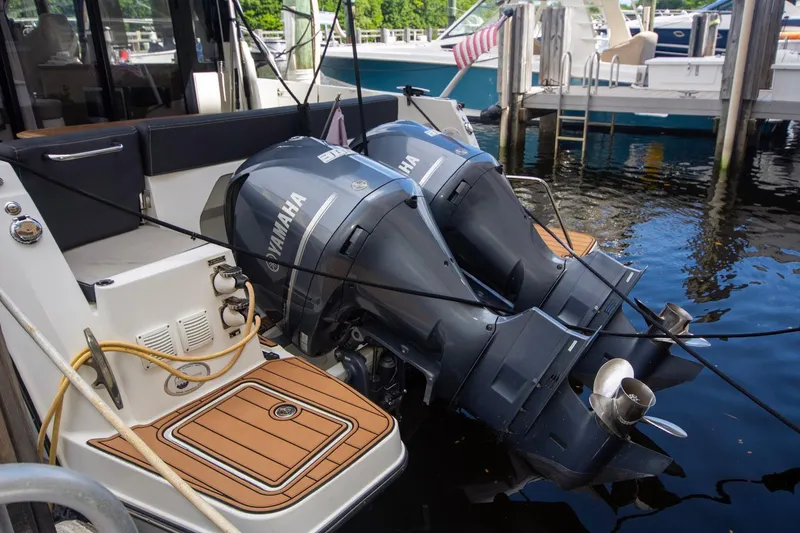 Sea Scape Yacht Photos Pics 2021 Jeanneau NC 1095 with dual Yamaha outboard engines docked at marina.