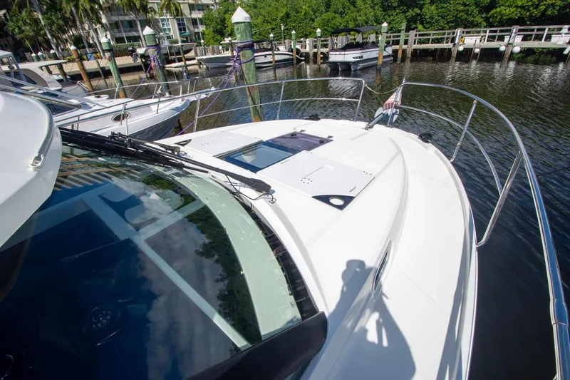 Sea Scape Yacht Photos Pics 2021 Jeanneau NC 1095 boat docked at marina, featuring sleek design and spacious deck.