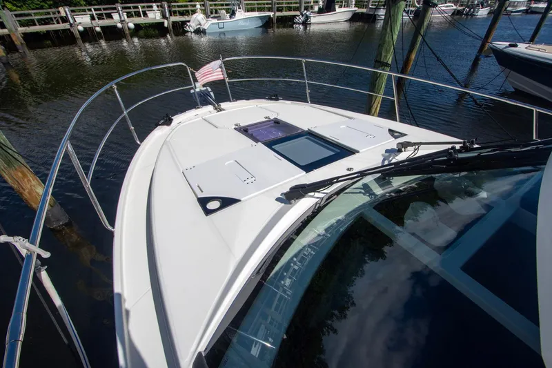 Sea Scape Yacht Photos Pics 2021 Jeanneau NC 1095 boat docked, featuring sleek design and spacious deck.