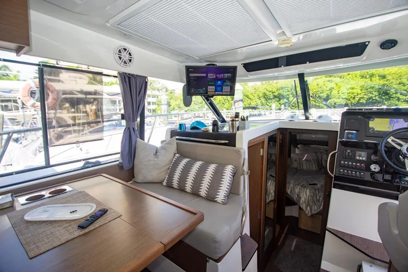 Sea Scape Yacht Photos Pics Interior of 2021 Jeanneau NC 1095 boat with modern seating and navigation equipment.
