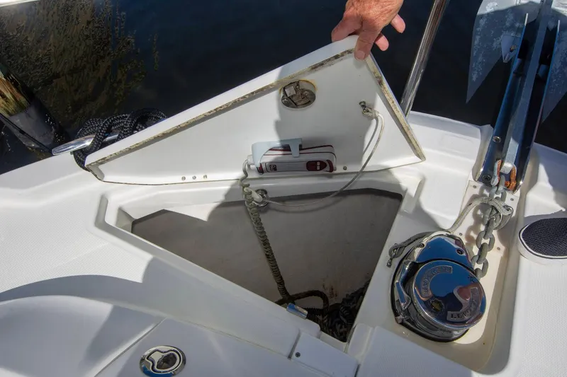 Sea Scape Yacht Photos Pics 2021 Jeanneau NC 1095 anchor locker with open hatch and visible chain mechanism.