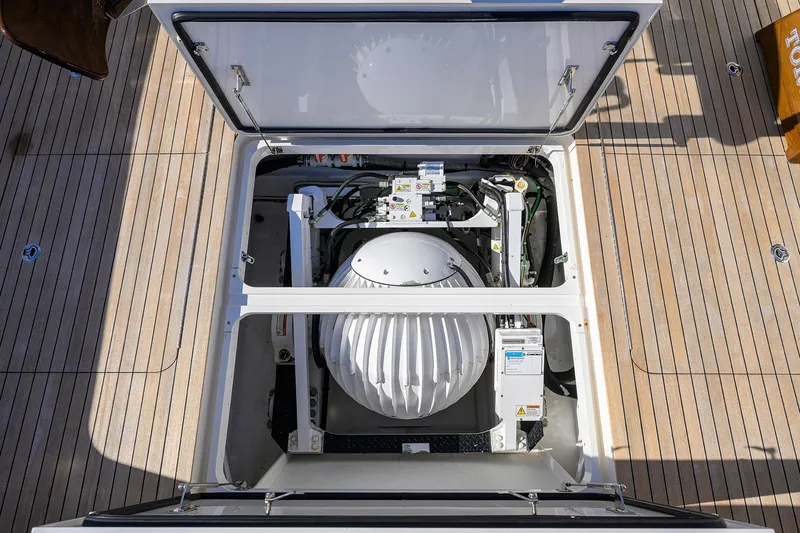 Torta Yacht Photos Pics Engine compartment of 2017 Viking 72 Enclosed Bridge yacht, showcasing mechanical components.