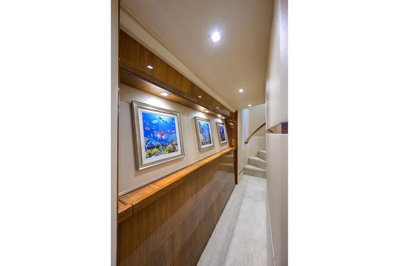Torta Yacht Photos Pics Luxurious hallway in 2017 Viking 72 Enclosed Bridge yacht with marine artwork.