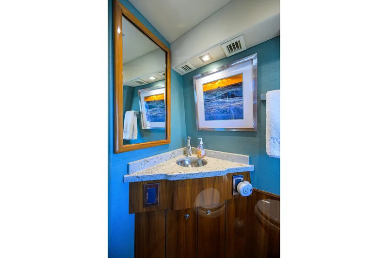 Torta Yacht Photos Pics Luxurious bathroom in 2017 Viking 72 Enclosed Bridge yacht with elegant fixtures and artwork.