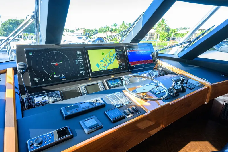 Torta Yacht Photos Pics Cockpit of 2017 Viking 72 Enclosed Bridge yacht with advanced navigation systems.
