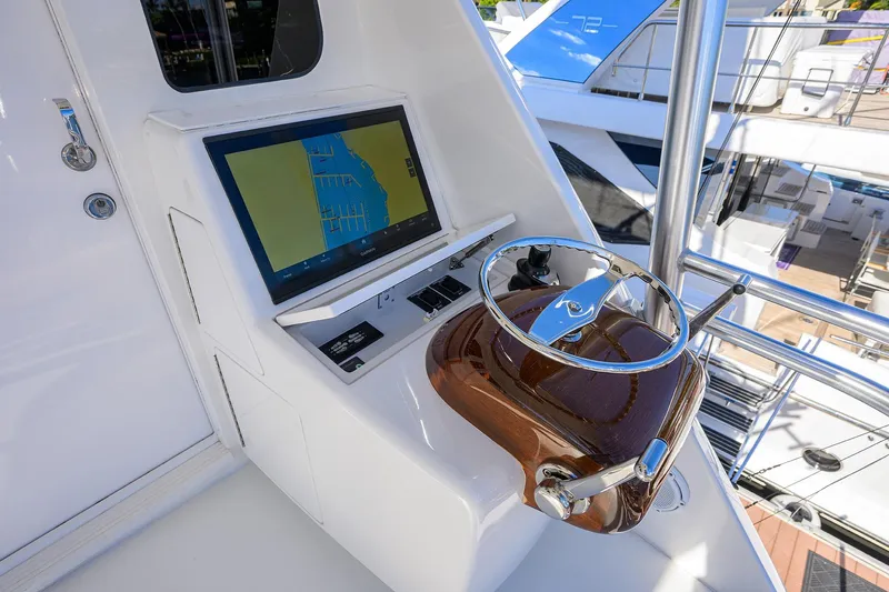 Torta Yacht Photos Pics Helm station of 2017 Viking 72 Enclosed Bridge yacht with navigation display.