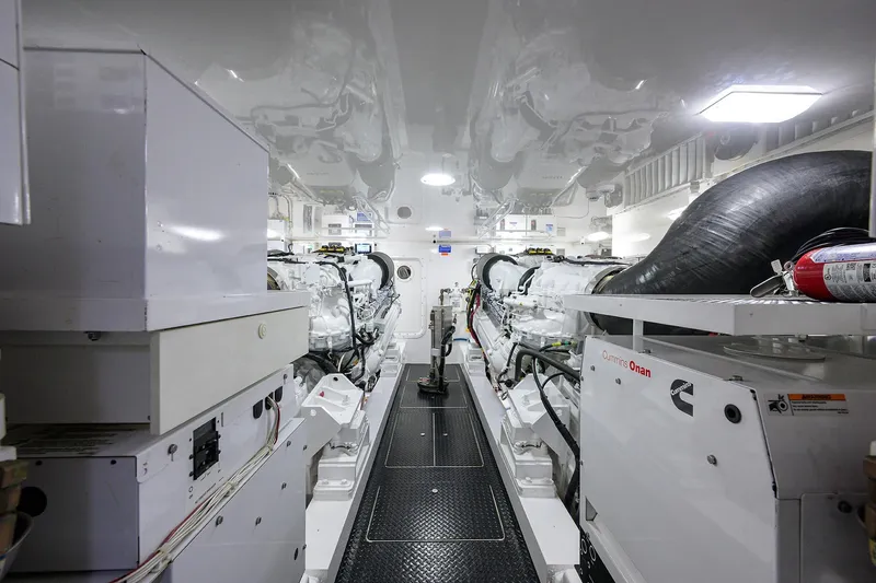 Torta Yacht Photos Pics Engine room of 2017 Viking 72 Enclosed Bridge yacht, featuring Cummins Onan generator.