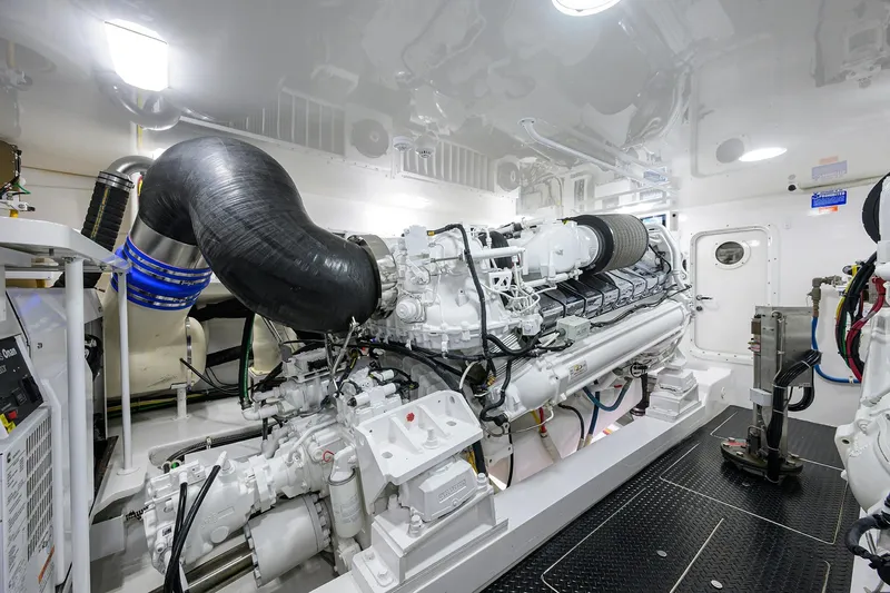 Torta Yacht Photos Pics Engine room of 2017 Viking 72 Enclosed Bridge yacht, showcasing powerful machinery and clean design.