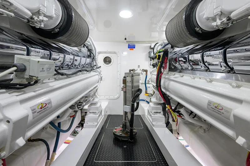 Torta Yacht Photos Pics Engine room of 2017 Viking 72 Enclosed Bridge yacht, showcasing advanced machinery and equipment.