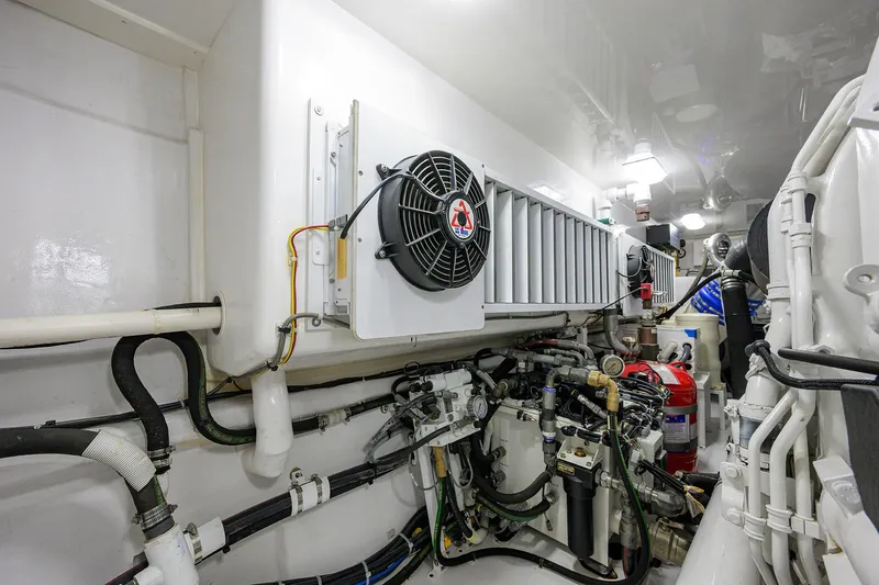 Torta Yacht Photos Pics Engine room of 2017 Viking 72 Enclosed Bridge yacht, showcasing mechanical components and systems.