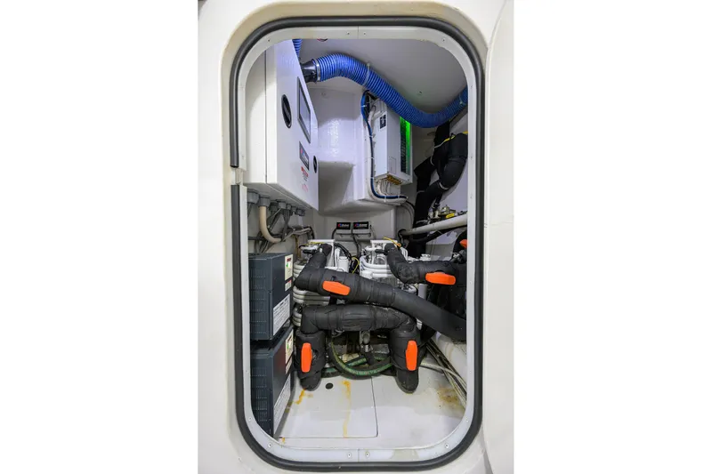 Torta Yacht Photos Pics Engine room of 2017 Viking 72 Enclosed Bridge yacht, showcasing mechanical components and systems.