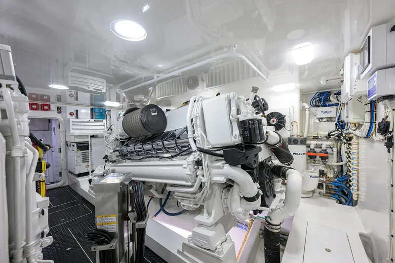 Torta Yacht Photos Pics Engine room of 2017 Viking 72 Enclosed Bridge yacht, showcasing advanced machinery and equipment.