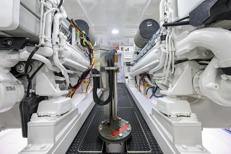 Torta Yacht Photos Pics Engine room of 2017 Viking 72 Enclosed Bridge yacht, showcasing dual engines and mechanical systems.