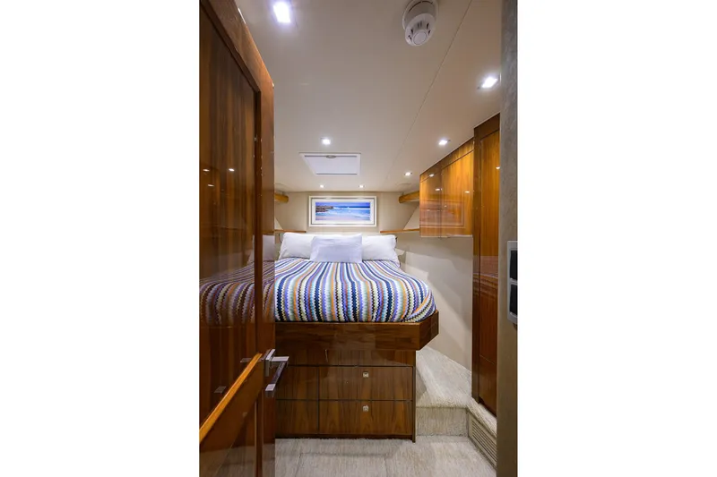 Torta Yacht Photos Pics Luxurious cabin interior of 2017 Viking 72 Enclosed Bridge yacht with cozy bed.