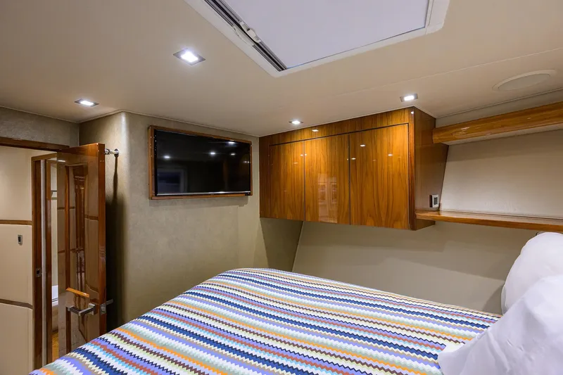 Torta Yacht Photos Pics Luxurious cabin interior of 2017 Viking 72 Enclosed Bridge yacht with modern amenities.