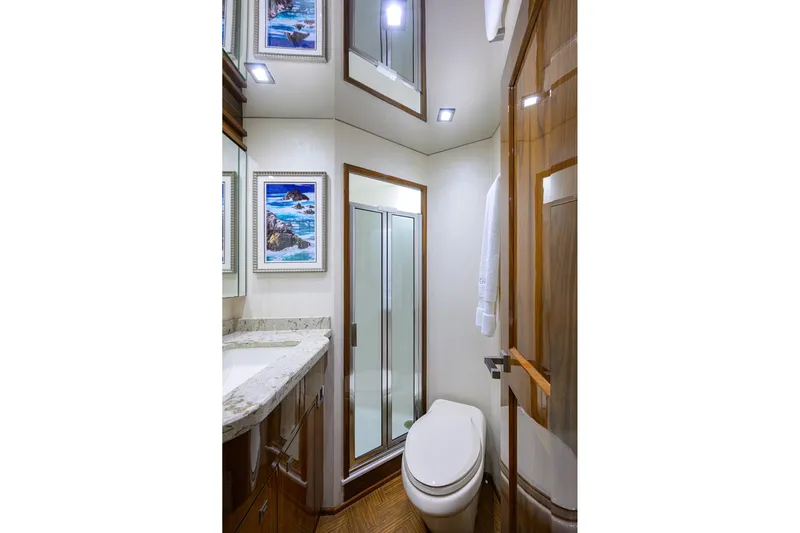 Torta Yacht Photos Pics Luxurious bathroom in 2017 Viking 72 Enclosed Bridge yacht with modern fixtures and elegant decor.