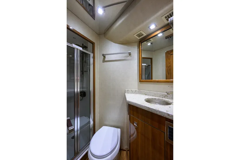 Torta Yacht Photos Pics Luxurious bathroom in 2017 Viking 72 Enclosed Bridge yacht with shower and vanity.