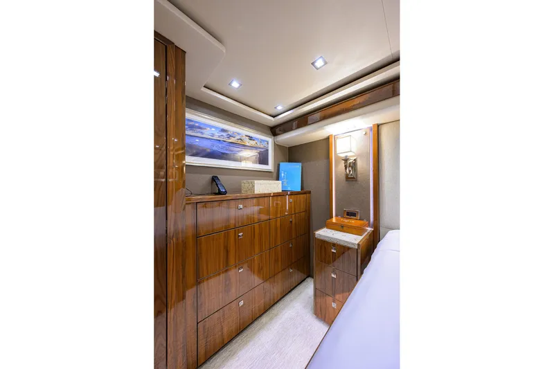 Torta Yacht Photos Pics Luxurious interior of 2017 Viking 72 Enclosed Bridge yacht with elegant wood cabinetry.