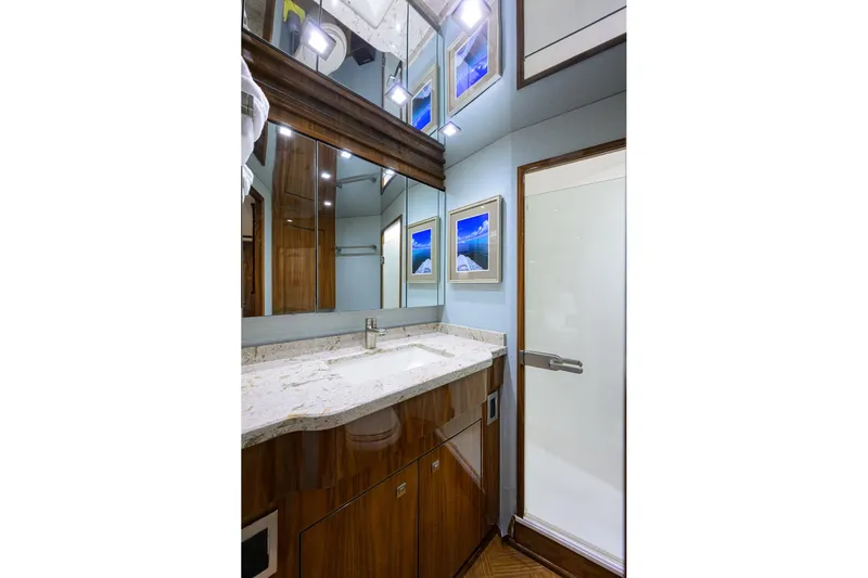 Torta Yacht Photos Pics Luxurious bathroom in 2017 Viking 72 Enclosed Bridge yacht with modern fixtures and elegant design.