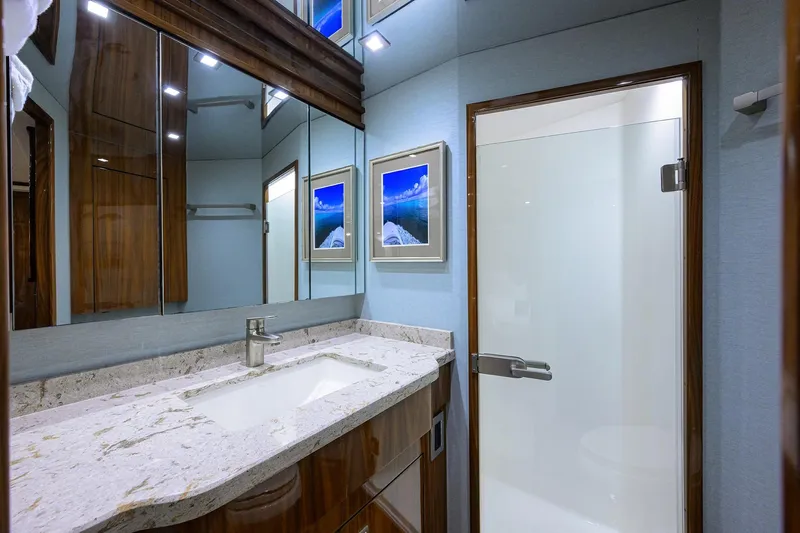 Torta Yacht Photos Pics Luxurious bathroom in 2017 Viking 72 Enclosed Bridge yacht with modern fixtures and elegant design.