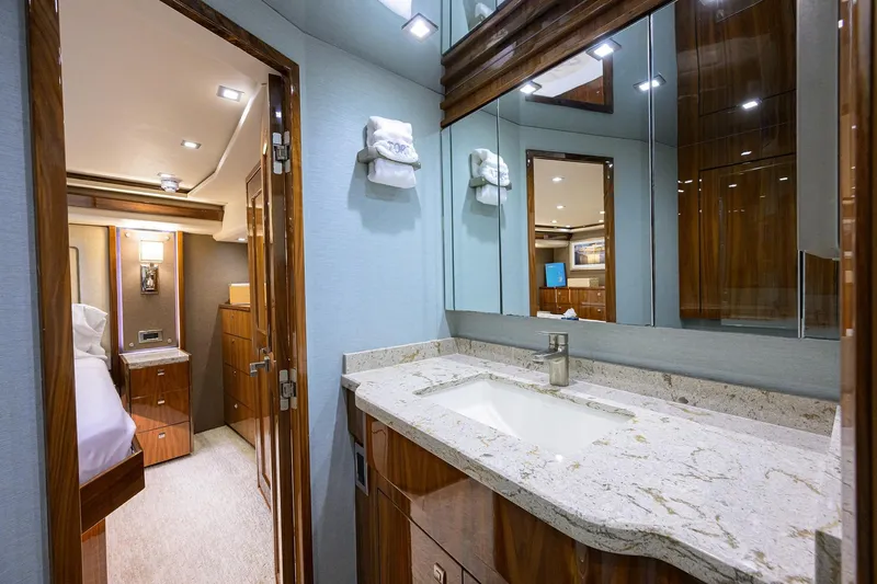 Torta Yacht Photos Pics Luxurious bathroom interior of 2017 Viking 72 Enclosed Bridge yacht with elegant wood finishes.