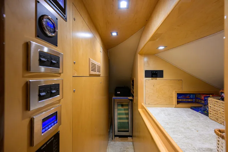 Torta Yacht Photos Pics Interior of 2017 Viking 72 Enclosed Bridge yacht with control panels and storage area.