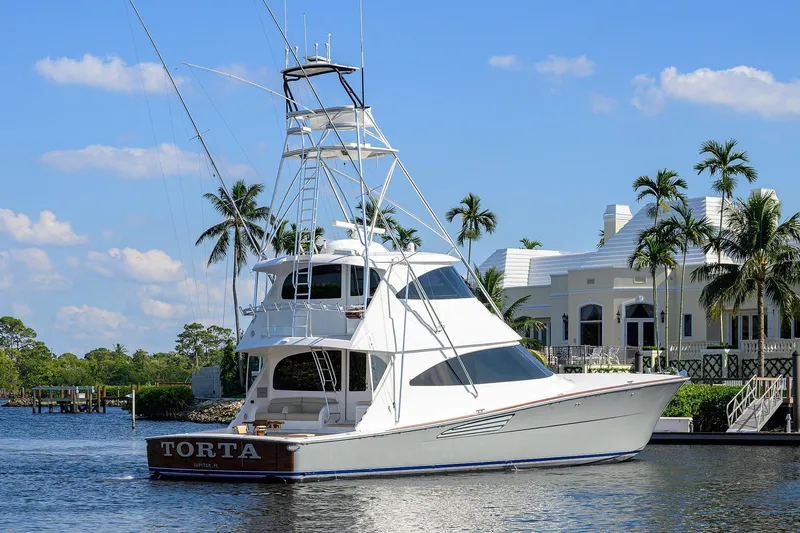 Torta Yacht Photos Pics 2017 Viking 72 Enclosed Bridge yacht docked near luxury waterfront home.