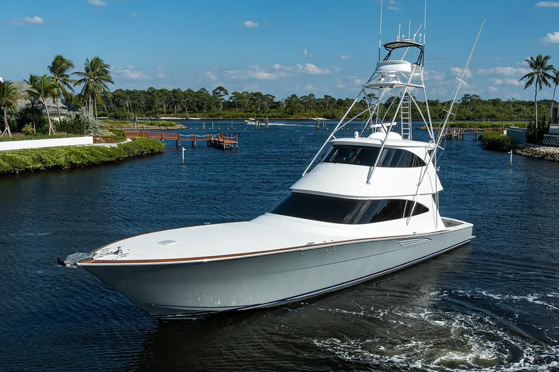 Torta Yacht Photos Pics 2017 Viking 72 Enclosed Bridge yacht cruising in a scenic tropical waterway.