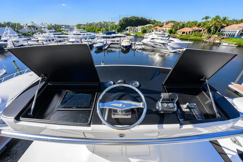 Torta Yacht Photos Pics Cockpit view of 2017 Viking 72 Enclosed Bridge yacht at marina.