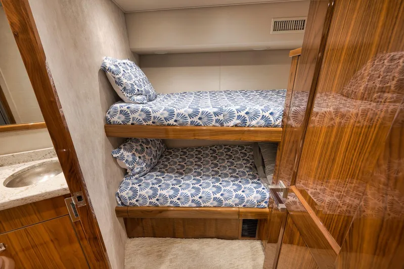 Torta Yacht Photos Pics Bunk beds in 2017 Viking 72 Enclosed Bridge yacht cabin with patterned bedding.