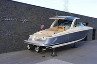 2024 Chris-Craft Launch 35GT boat displayed outdoors, showcasing sleek design and luxury features.