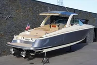 2024 Chris-Craft Launch 35GT boat displayed outdoors, featuring sleek design and luxury seating.