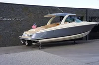 2024 Chris-Craft Launch 35GT boat displayed outdoors with American flag.