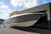 2024 Chris-Craft Launch 35GT boat displayed outdoors against a modern building.