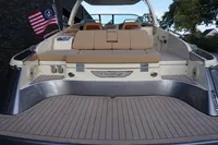 2024 Chris-Craft Launch 35GT boat with elegant deck and seating, featuring American flag.