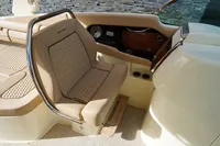 2024 Chris-Craft Launch 35GT interior with beige seating and elegant dashboard design.