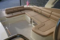 2024 Chris-Craft Launch 35GT boat interior with luxurious tan seating and American flag.