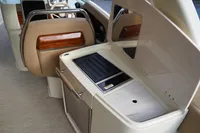 2024 Chris-Craft Launch 35GT interior with sleek kitchenette and luxurious seating.
