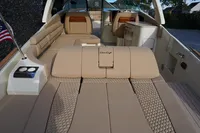 2024 Chris-Craft Launch 35GT interior with luxurious beige seating and American flag.