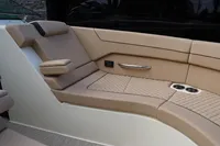 2024 Chris-Craft Launch 35GT interior seating with beige upholstery and cup holders.