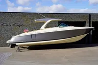 2024 Chris-Craft Launch 35GT boat displayed outdoors with American flag.