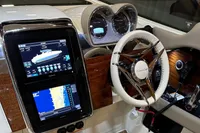 2024 Chris-Craft Launch 35GT dashboard with navigation screens and steering wheel.