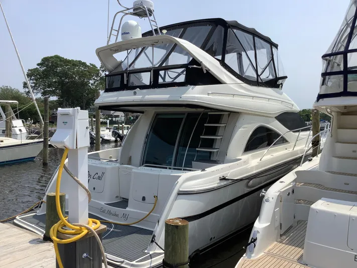 Knot On Call II Yacht Photos Pics 2000 Maxum 4600 SCB yacht docked at marina, featuring sleek design and spacious upper deck.