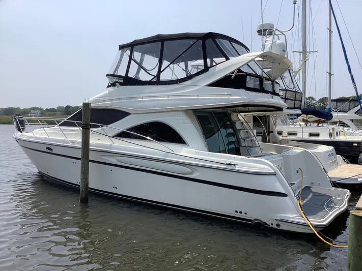 Knot On Call II Yacht Photos Pics 2000 Maxum 4600 SCB yacht docked in marina, featuring sleek design and spacious upper deck.