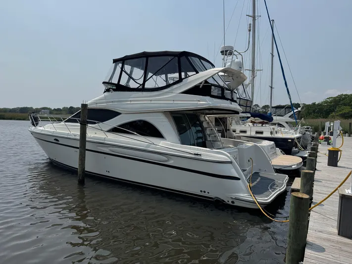 Knot On Call II Yacht Photos Pics 2000 Maxum 4600 SCB yacht docked at marina, featuring sleek design and spacious upper deck.