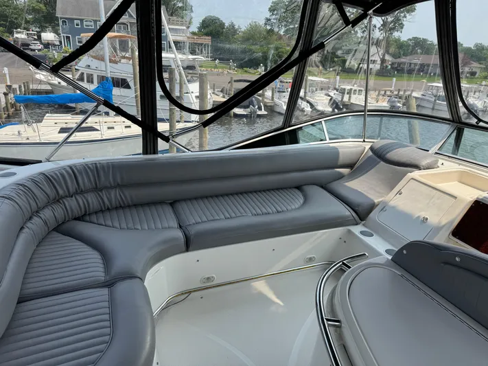 Knot On Call II Yacht Photos Pics Luxurious seating area on a 2000 Maxum 4600 SCB yacht, docked at a marina.