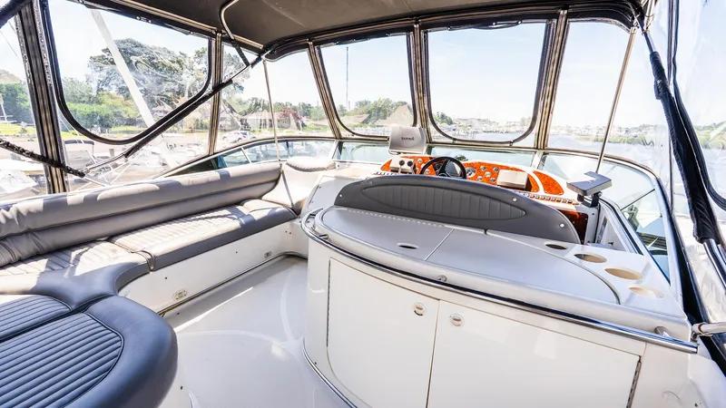 Knot On Call II Yacht Photos Pics Luxurious interior of 2000 Maxum 4600 SCB yacht with spacious seating and modern helm.